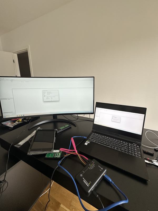 A mobile forensics bench with a tablet in an antistatic bag, an interface board and an imaging device
